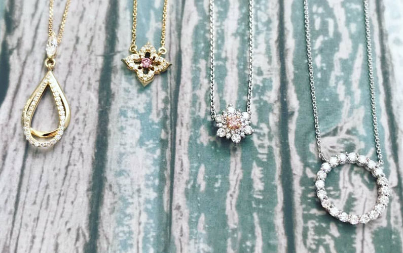 A range of beautifully crafted pink diamond pendant necklaces in gold