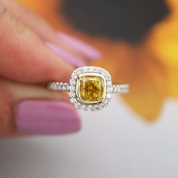 Cushion cut yellow diamond halo engagement ring